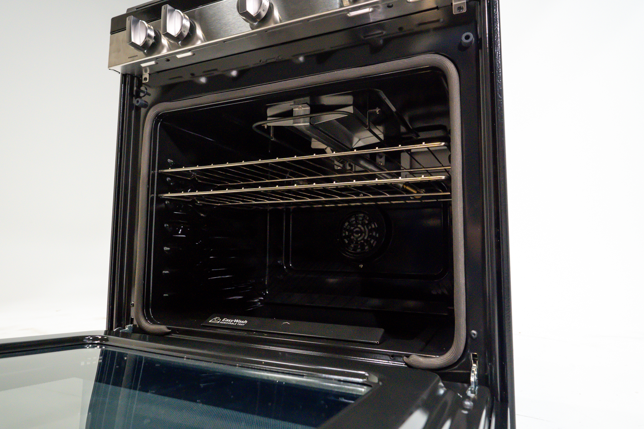 NEU Appliance Repair technician explaining True Convection oven technology to a homeowner in Austin, TX