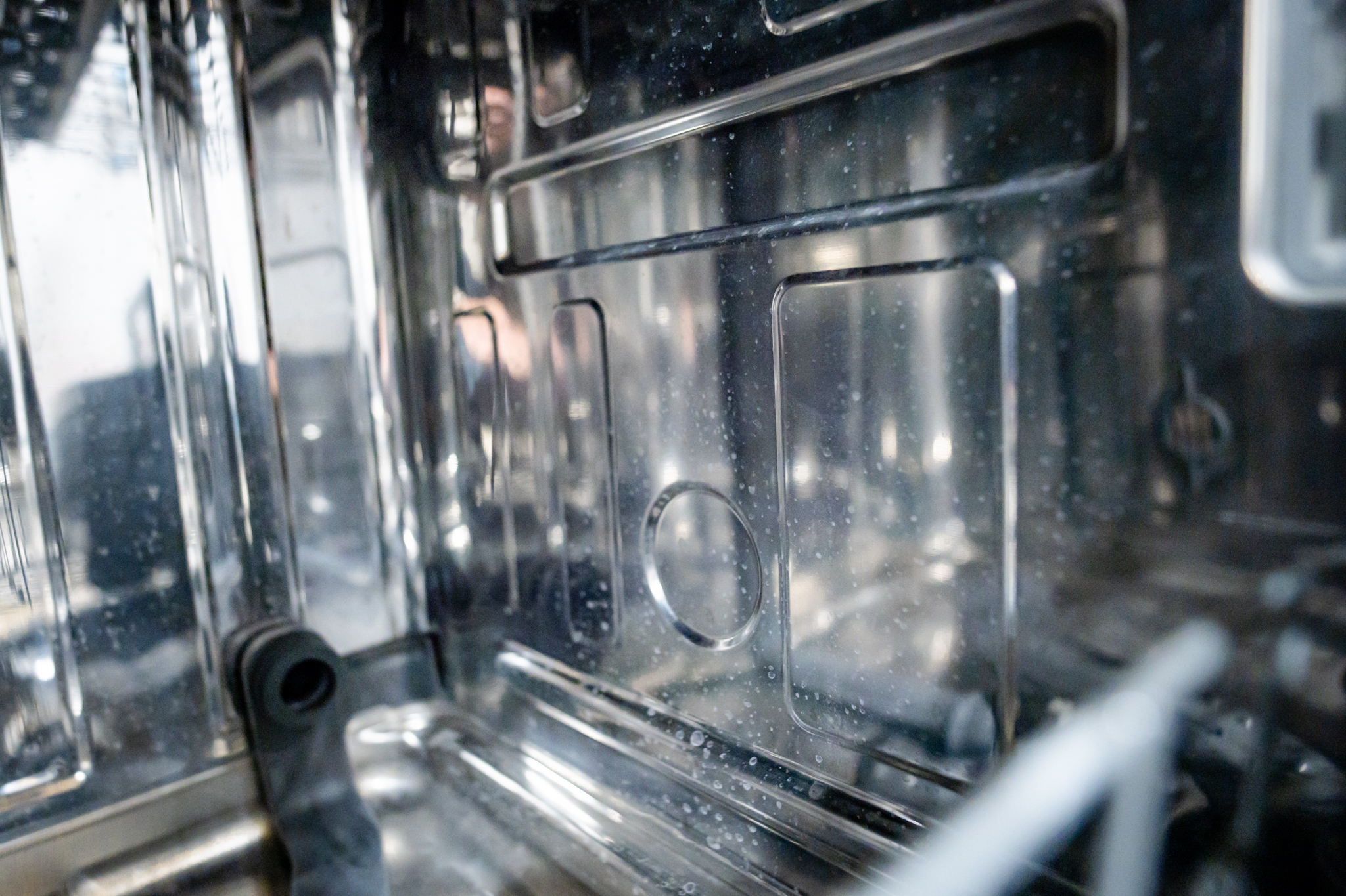 Professional NEU Appliance Repair technician holding a tablet, ready to provide a diagnostic quote for dishwasher repair.